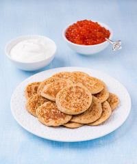Buckwheat blini with red caviar and sour cream