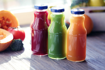 Bottles of juice with fruits and vegetables