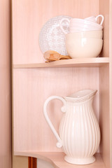 Tableware on wooden shelves