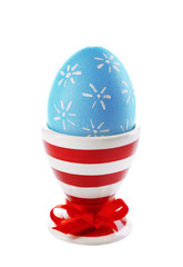 Boiled egg in holder isolated on white