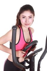 Fototapeta na wymiar young woman doing exercises with exercise machine