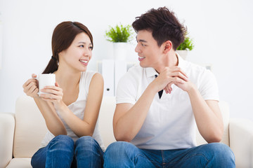 happy Young couple relaxing in sofa