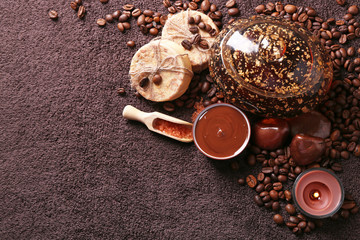 Composition of soap, chocolate in bowl and coffee beans
