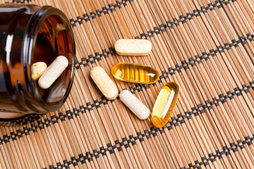 Multivitamin Pills in a brown medicine jar