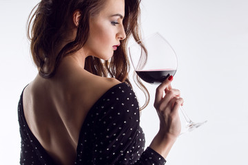 Beautiful young woman with wine glass - 79712765