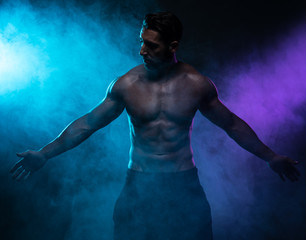 Silhouette Shirtless Muscled Man Posing in Smoke