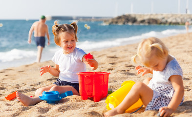  little children  on beach