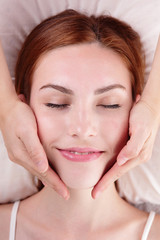 young woman enjoy face massage