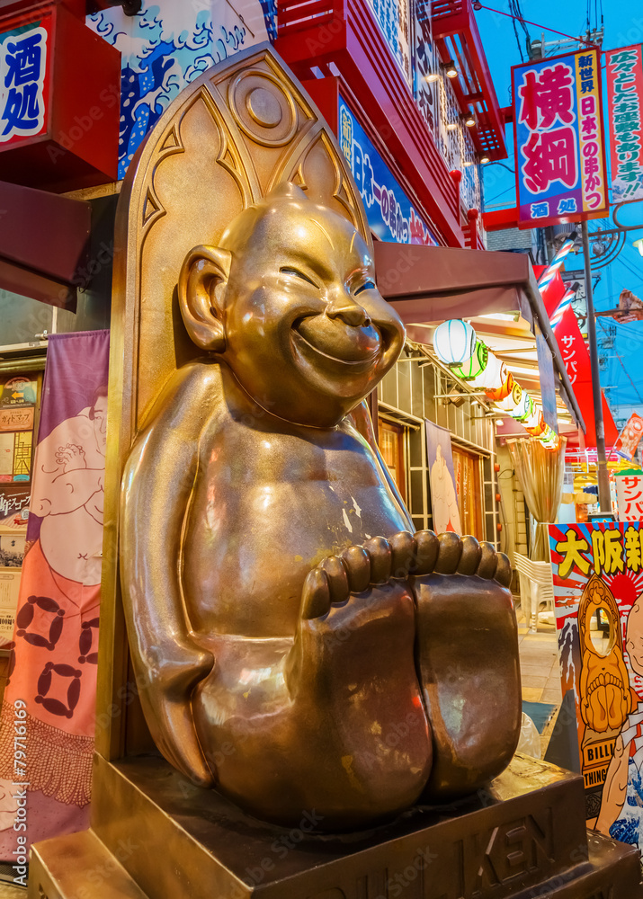 Poster a sculpture of deity at shinsekai district in osaka