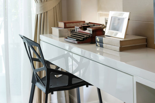 decorative working table with typewriter and books - Powered by Adobe
