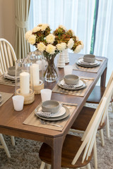 dining table and comfortable chairs in modern home with elegant