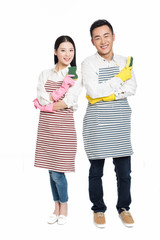 man and woman holding cleaning supplies