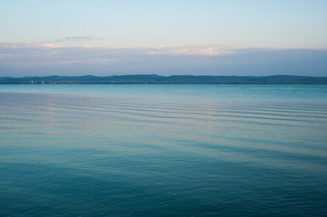 Beautiful calm lakes rippling water and with hills in the distance