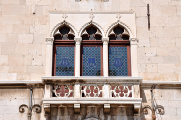 Fototapeta na wymiar Venetian windows and balcony