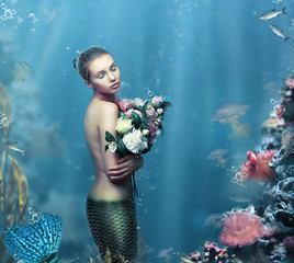 Inspiration. Fantastic Woman with Flowers in Water