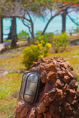 Lantern on the stone on the background of ocean