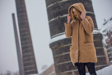 the girl in the coat on the street