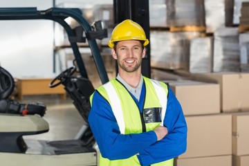 Worker wearing hard hat in warehouse