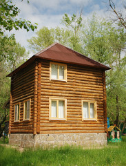 Two-storied wooden house on a sunny day.