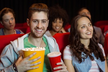 Young couple watching a film