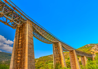 The historic bridge of Gorgopotamos river in central Greece. HDR - 79725913