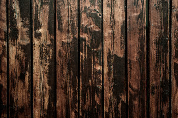 Brown stained gnarly wooden plank surface background image