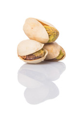 Pistachio nuts over white background