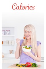 Obraz na płótnie Canvas Calories against blonde smiling woman eating her salad