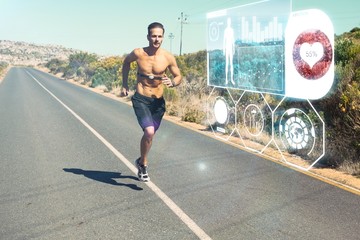 Athletic man jogging on open road with monitor