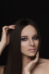Fototapeta premium Beauty natural face model with smoky eyes makeup and hair style