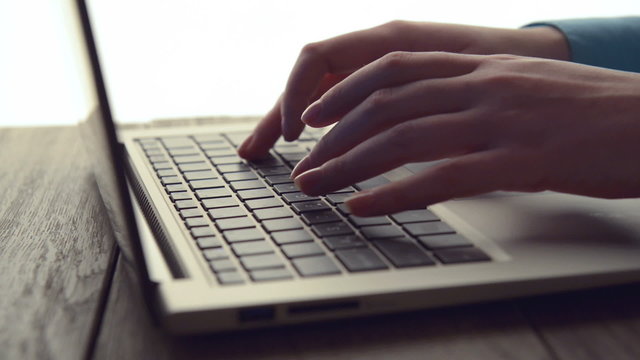 Women's hands typing on computer keyboard (HD)