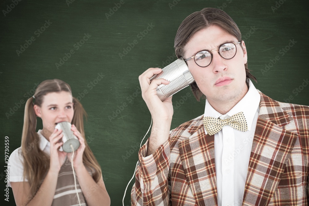 Poster Composite image of geeky hipsters using string phone
