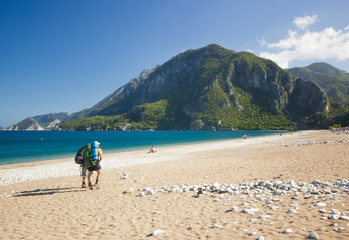 tourist walking on a sandy beach in turkey