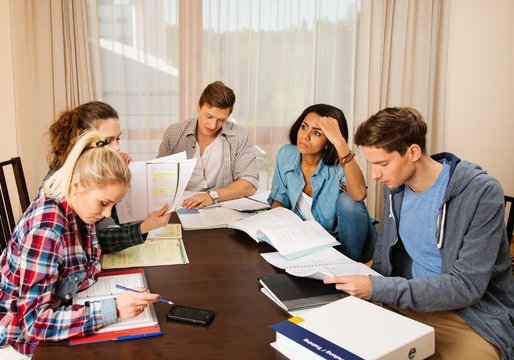 Students preparing for exams in home interior 
