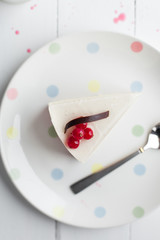 White cheesecake with red berries on a wooden table. Still life