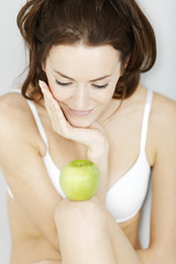 Woman with fresh apple