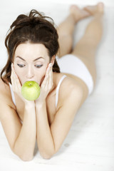 Obraz na płótnie Canvas Woman with fresh apple