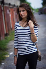 Fototapeta premium portrait of a cute girl in a t-shirt on the street