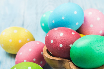 colored Easter eggs on wooden