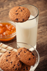 Homemade chocolate and nut cookies with chocolate with a glass o