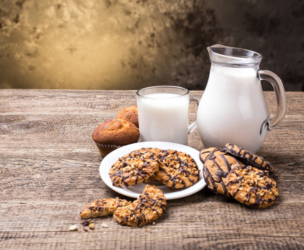 Breakfast with milk and cookies on wooden table