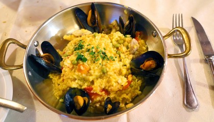 paella with fresh fish in the seafood restaurant