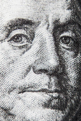 macro dollar bill with Benjamin Franklin portrait.