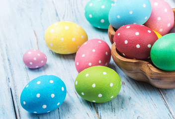 Fototapeta na wymiar colored Easter eggs on wooden background