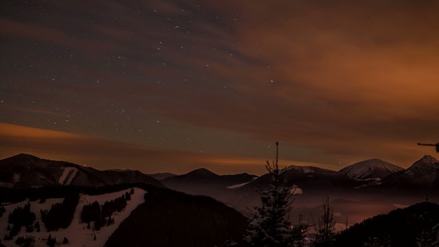 4k time lapse clouds in the night mountains