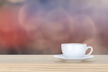 white cup of coffee on pine Wooden Table and bokeh,defocused lig
