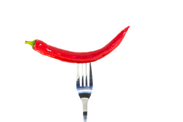 Fototapeta na wymiar Red hot chili pepper on the fork