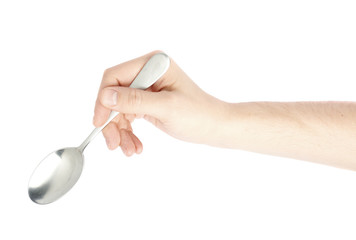 Male hand holding an empty spoon