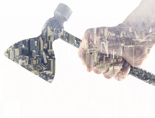double exposure hand ax and cityscape