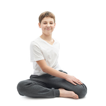 Young boy stretching or doing yoga